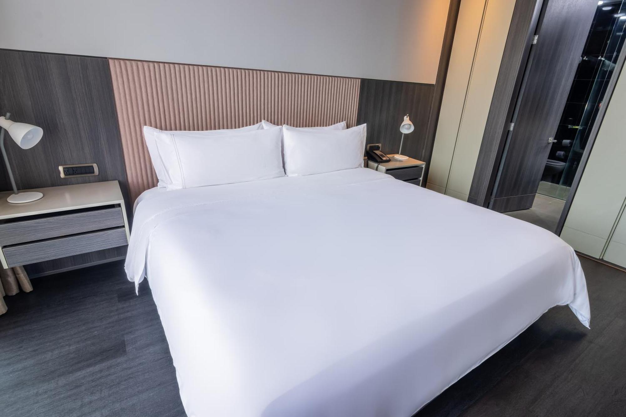Ghl Bioxury Hotel Bogotá Exterior foto A bed with a duvet cover